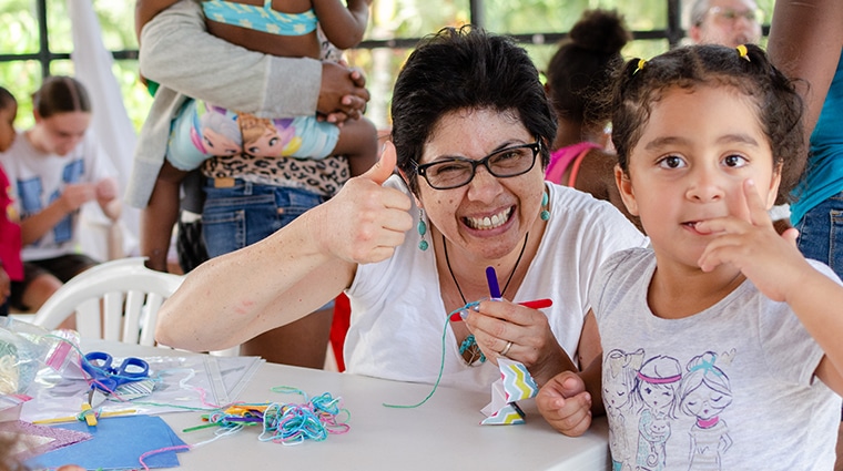 Woman and girl making crafts together